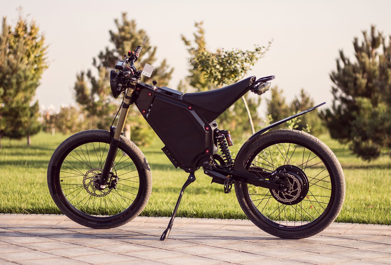 Electric bike battery motor wheel with pedal and rear shock absorber. Ebike bicycle environmentally friendly eco e-mountainbike transport. Healthy lifestyle